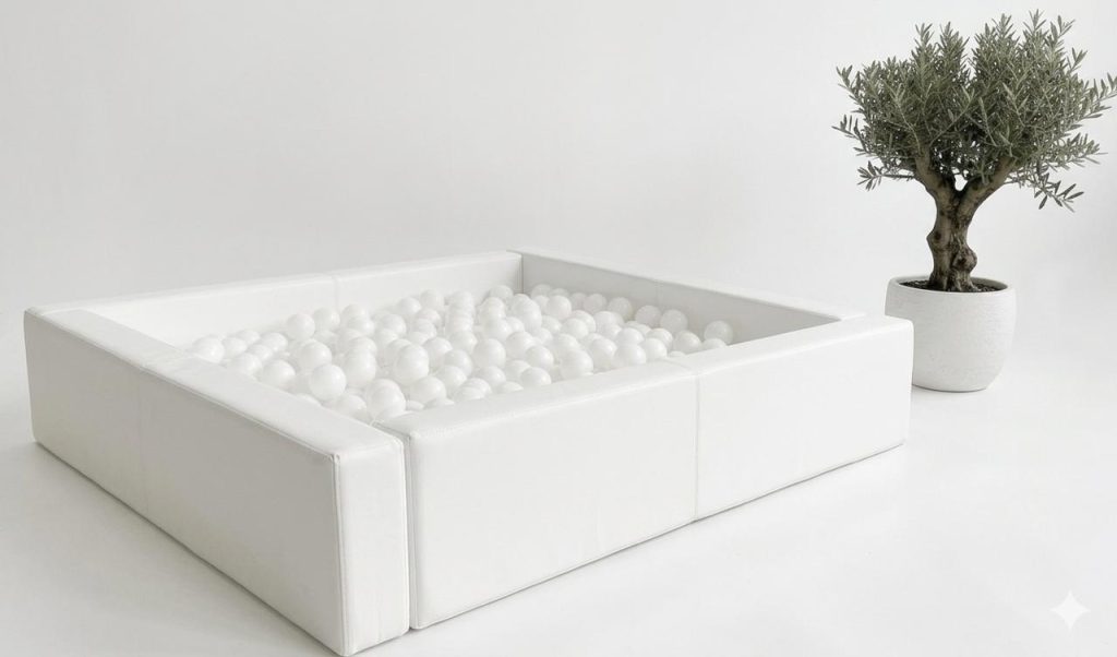 Square white ball pit filled with white balls