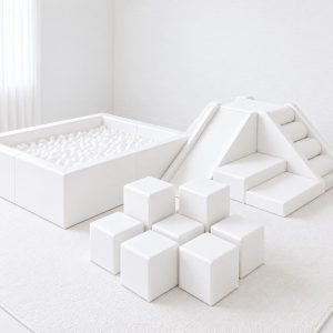 All-white soft play with ball pit, pyramid climber and nine building blocks
