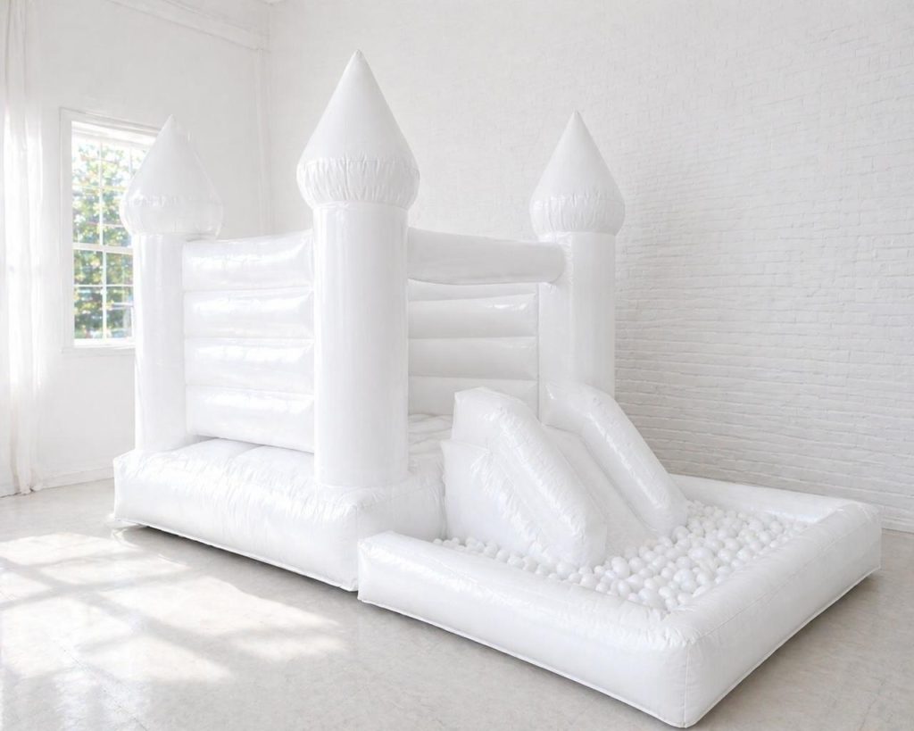White jumping castle with slide and ball pit